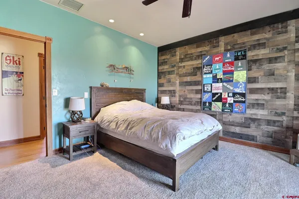 a kitchen with stainless steel appliances granite countertop a refrigerator a stove top oven a sink and dishwasher