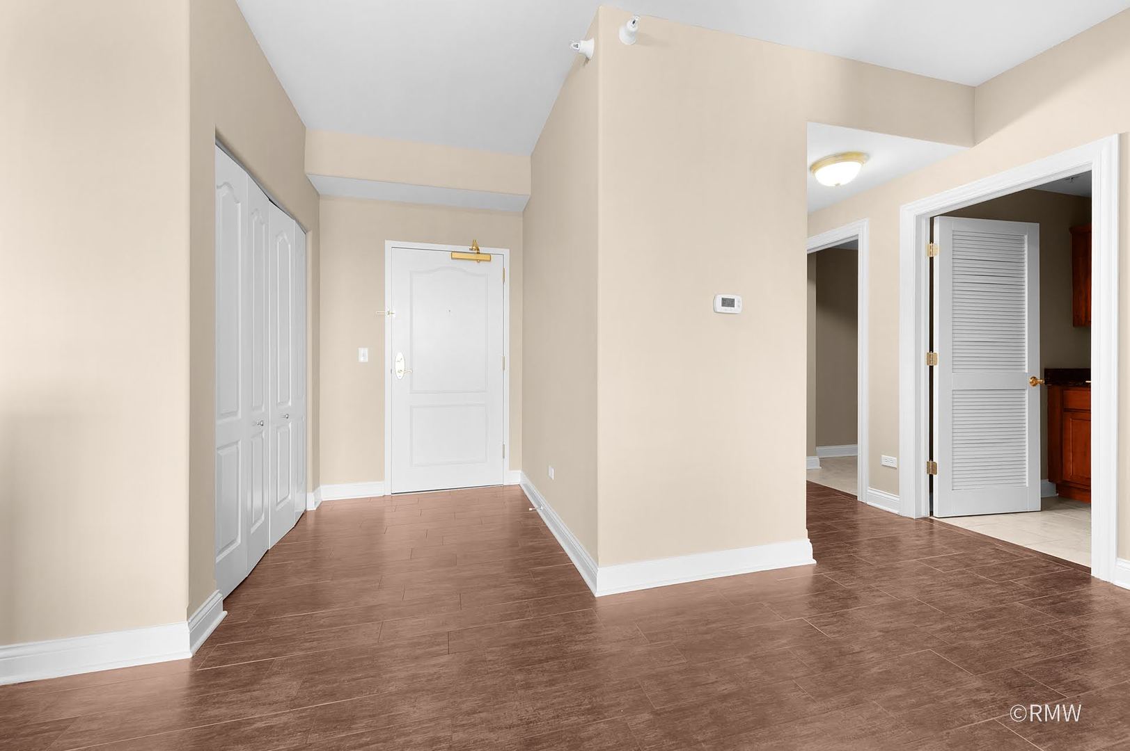 2 Itasca Place, Unit 420 Addison, IL 60143 - Photo 4 of 20 a view of hallway with wooden floor