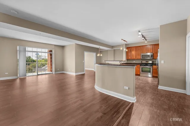 a view of a kitchen with wooden floor