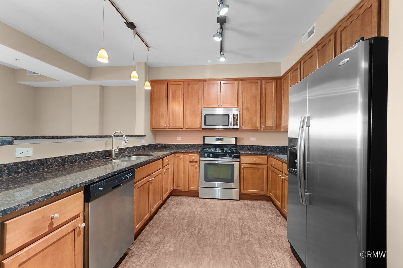 2 Itasca Place, Unit 420 Addison, IL 60143 - Photo 7 of 20 a kitchen with stainless steel appliances granite countertop a sink a stove a refrigerator cabinets and a counter top space