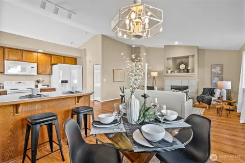 a view of a dining room with furniture window and wooden floor