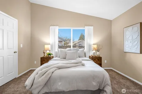 a bedroom with a bed and window