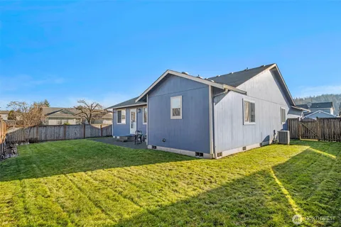 a view of a yard in front of a house with a big yard
