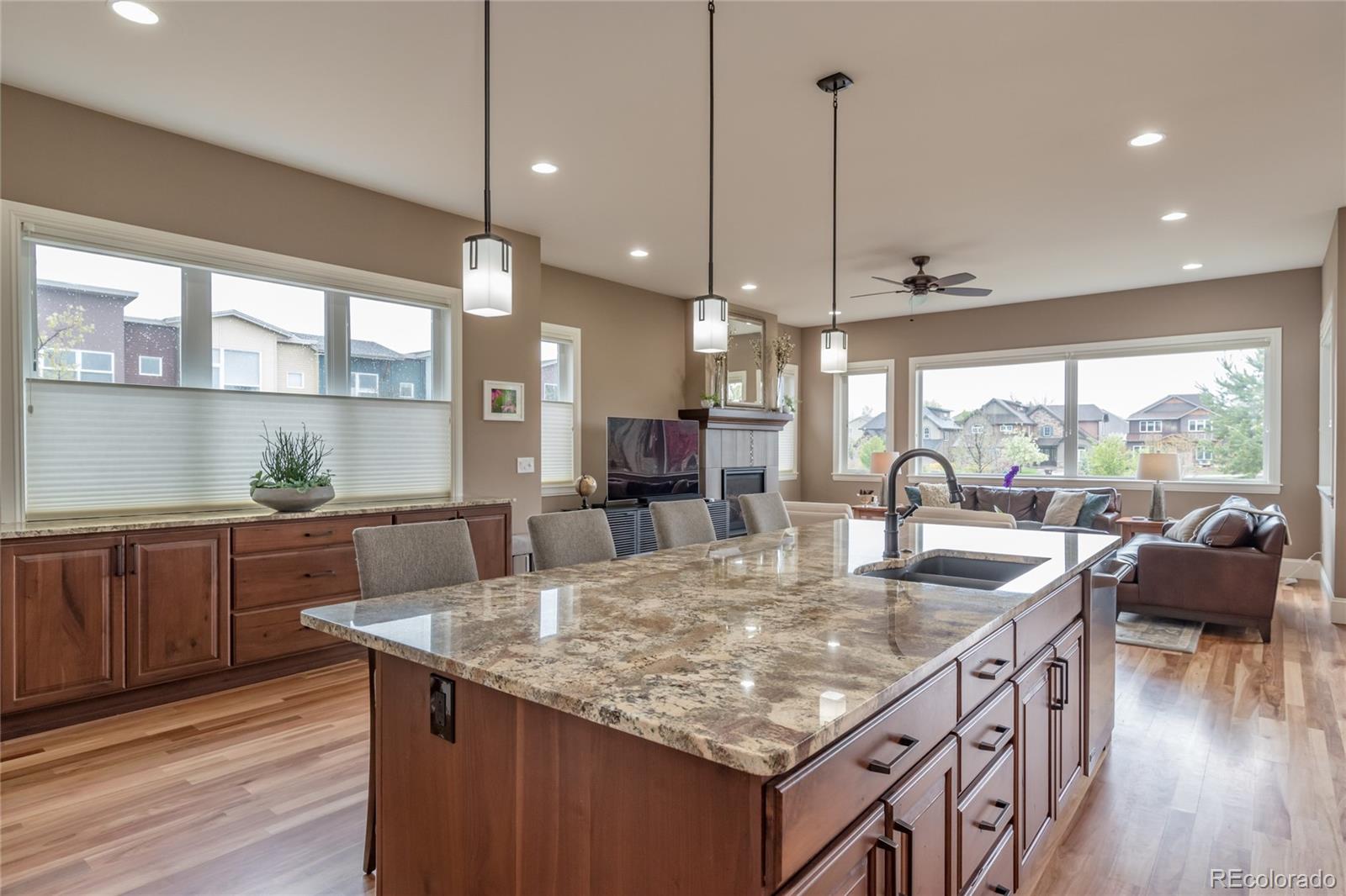 4624 Sunnyside Place Boulder, CO 80301 - Photo 14 of 40 a kitchen with granite countertop living room and kitchen island