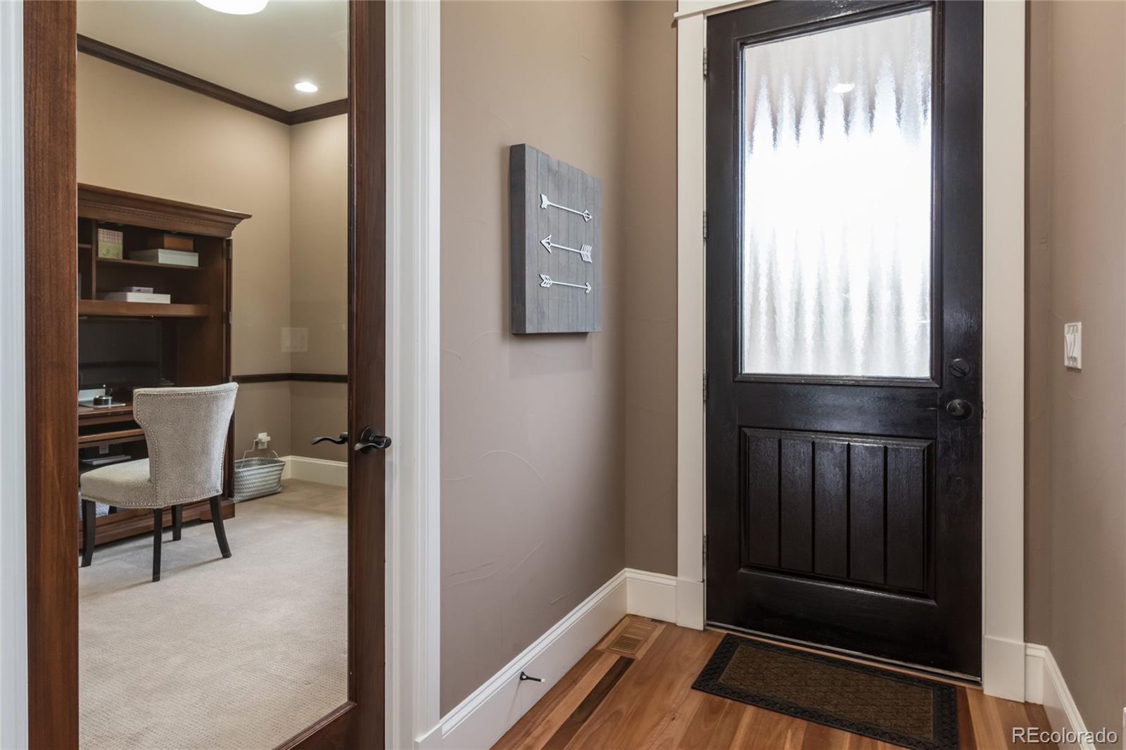 4624 Sunnyside Place Boulder, CO 80301 - Photo 2 of 40 a view of a hallway with wooden floor and a cabinet