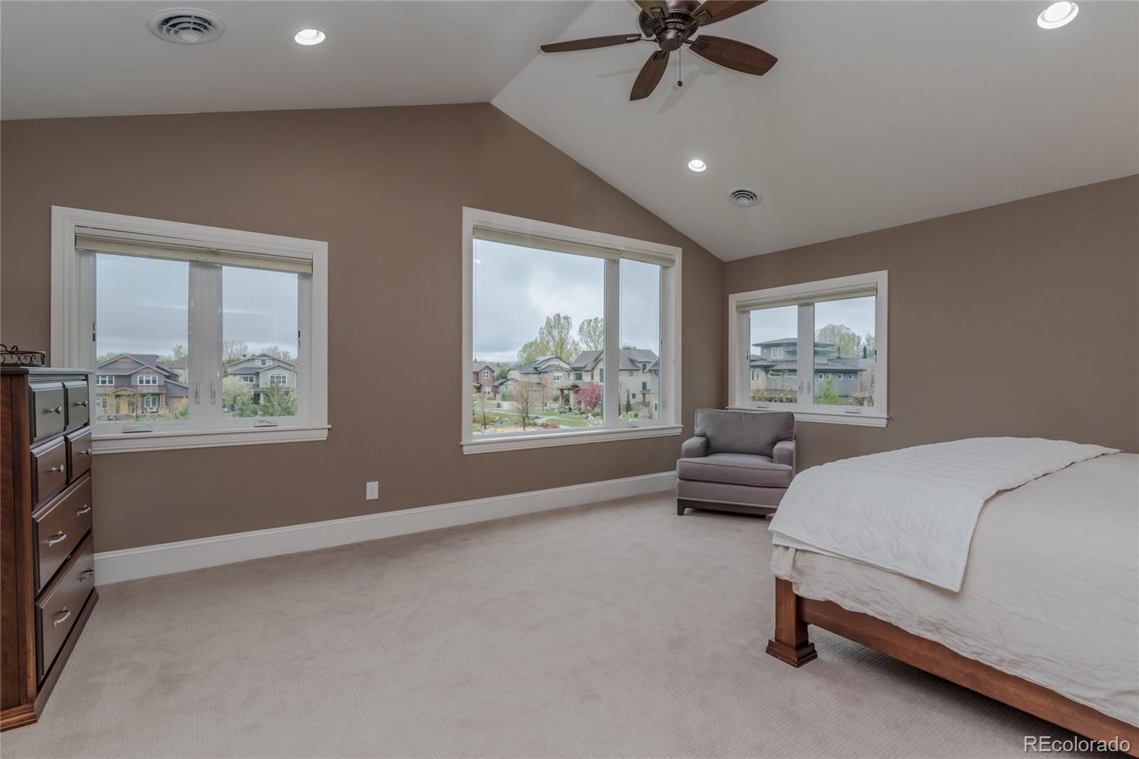 4624 Sunnyside Place Boulder, CO 80301 - Photo 21 of 40 a spacious bedroom with a bed and a large window
