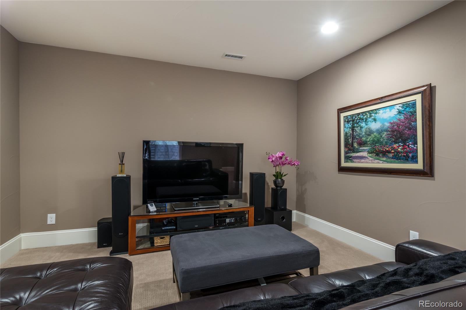 4624 Sunnyside Place Boulder, CO 80301 - Photo 36 of 40 a living room with furniture and a flat screen tv
