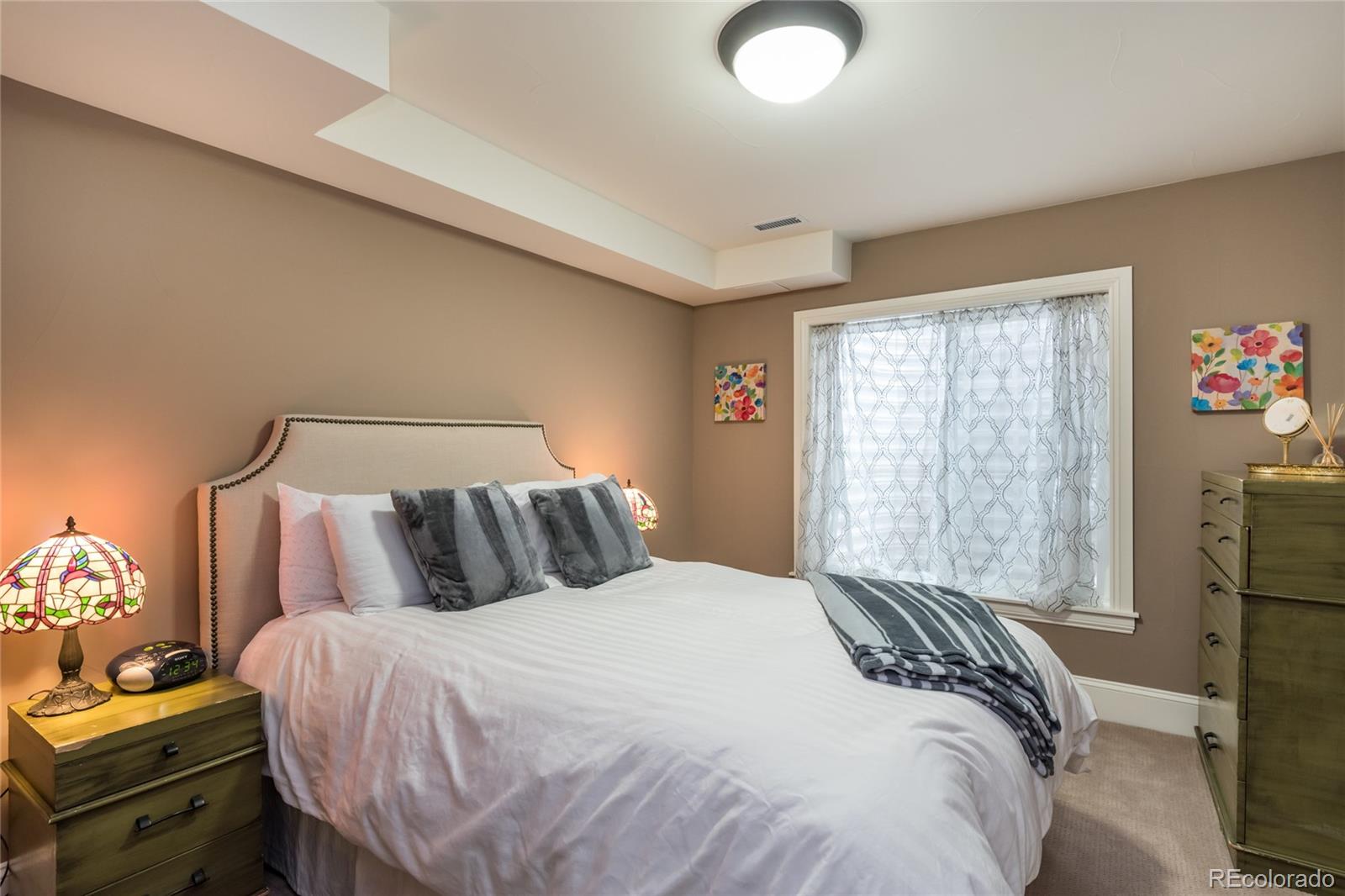 4624 Sunnyside Place Boulder, CO 80301 - Photo 38 of 40 a bedroom with a bed and wooden floor