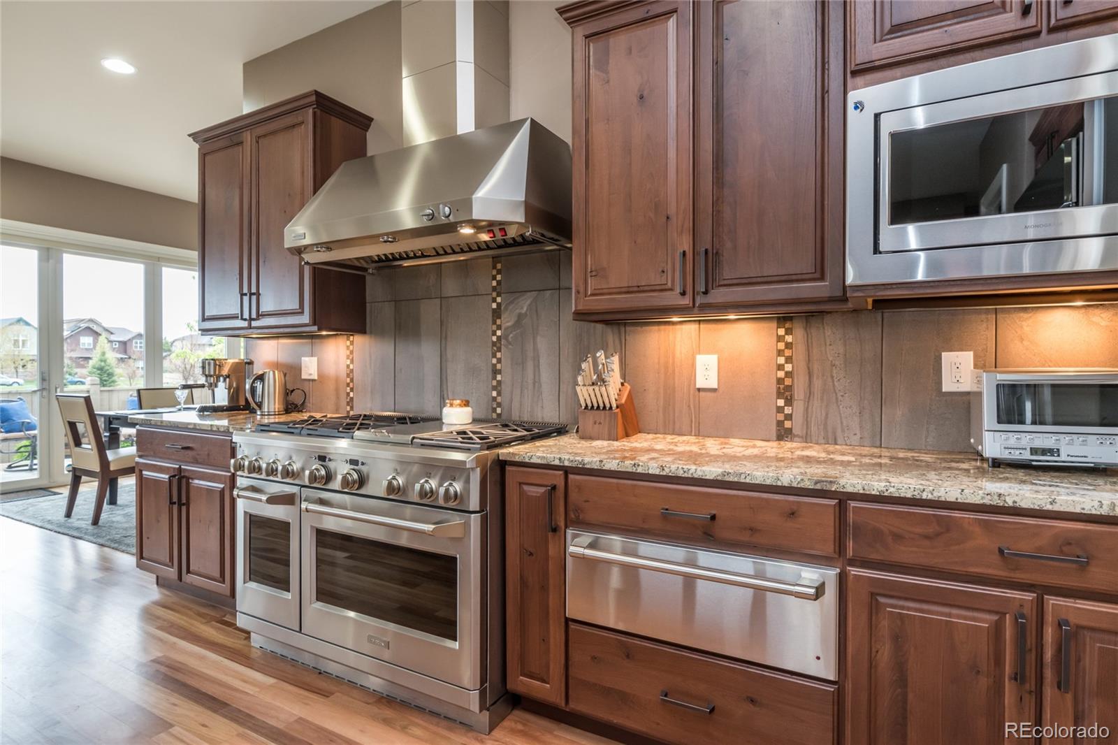 4624 Sunnyside Place Boulder, CO 80301 - Photo 7 of 40 a kitchen with a stove and a microwave