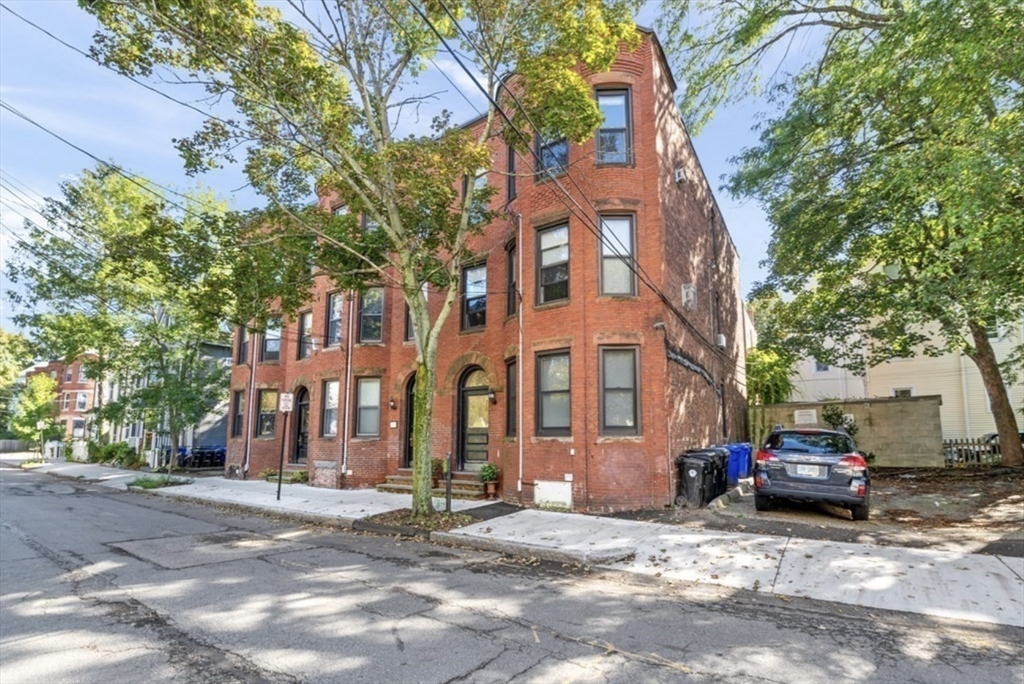 a view of a parked cars in front of a building
