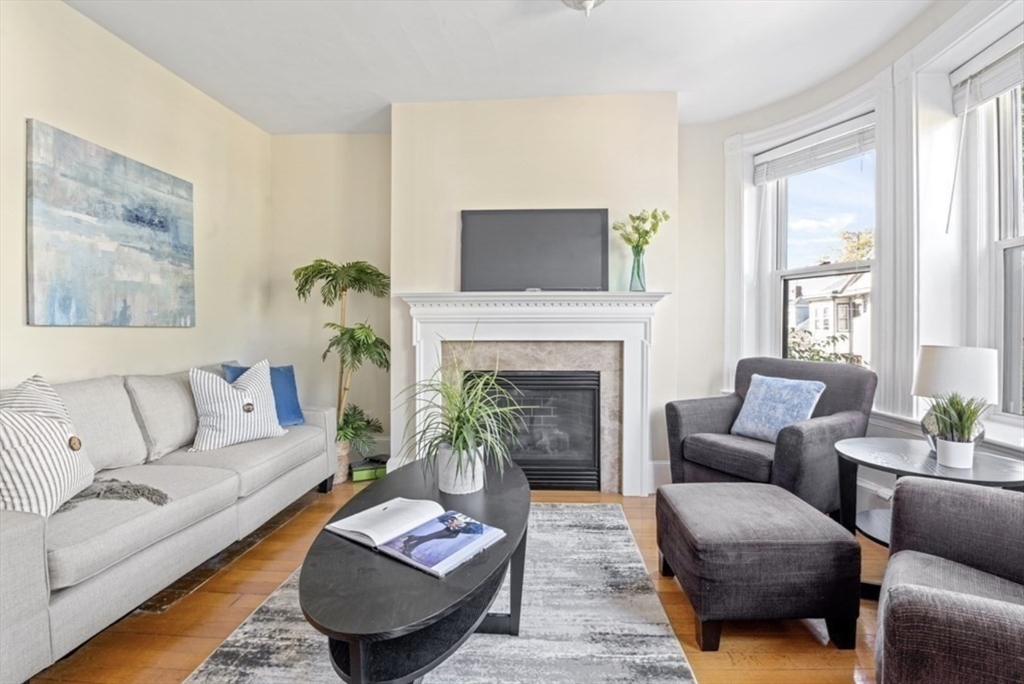 120 Brook Street, Unit 3 Brookline, MA 02445 - Photo 5 of 10 a living room with furniture and a fireplace