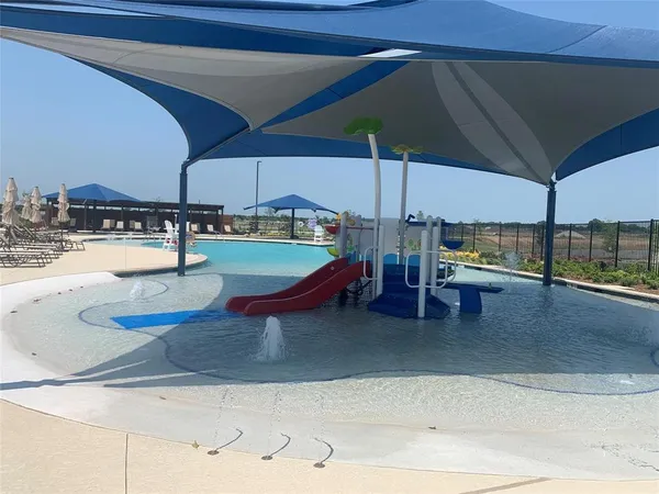 a view of a swimming pool with chairs