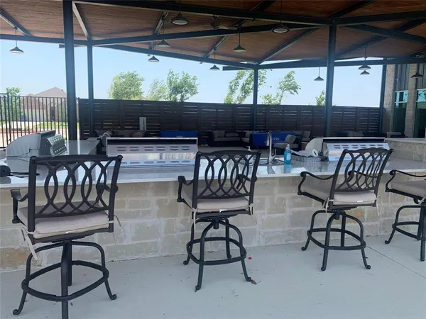 a patio with table and chairs