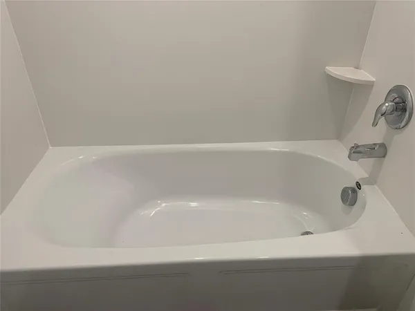 a close up of a bathtub in a bathroom
