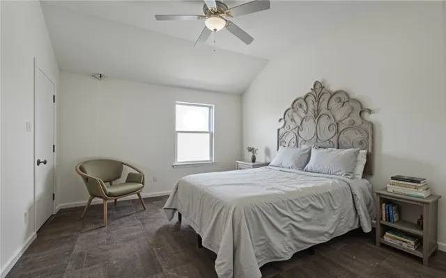 a kitchen with stainless steel appliances a dining table chairs microwave and stove