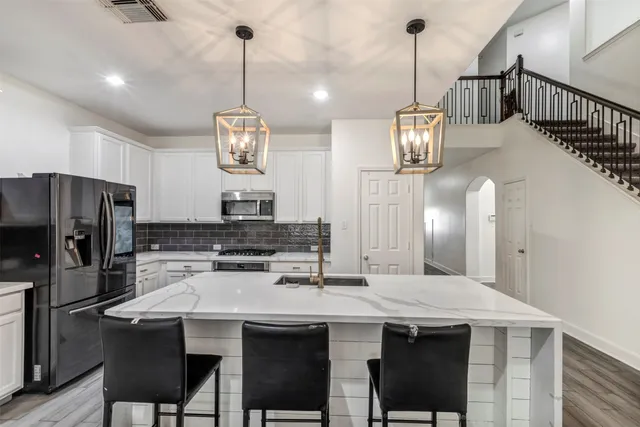 a living room with furniture wooden floor and a fireplace