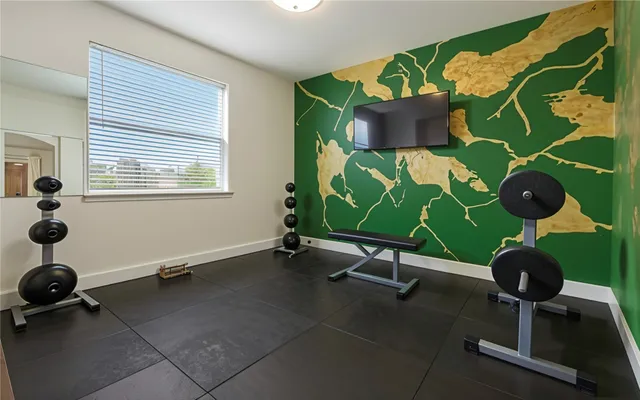 a view of a livingroom with a ceiling fan and window