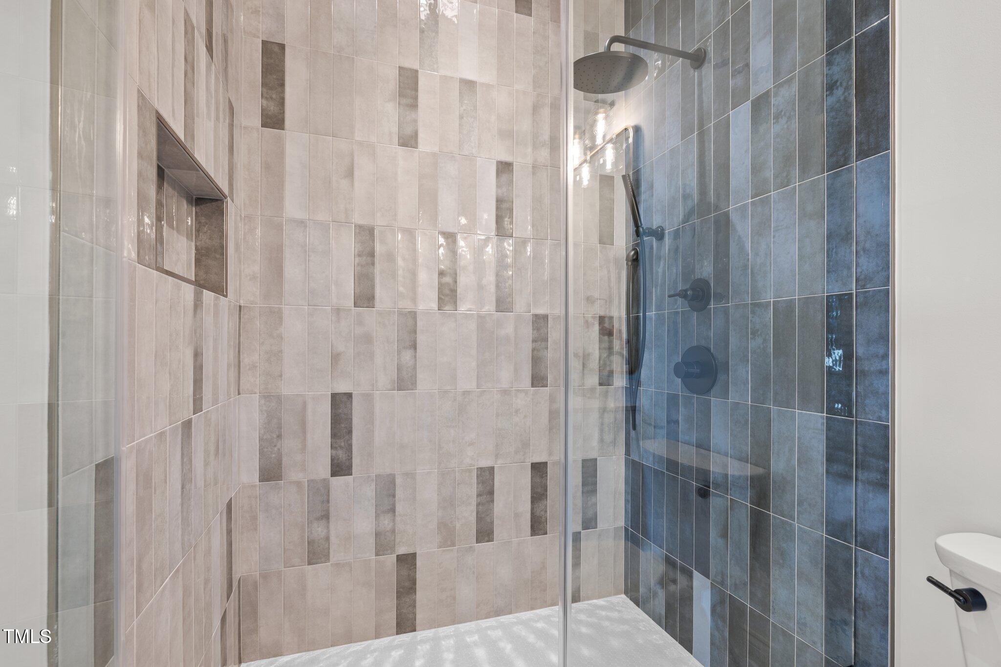 805 Tower Street, Unit 102 Raleigh, NC 27607 - Photo 26 of 36 a bathroom with a shower