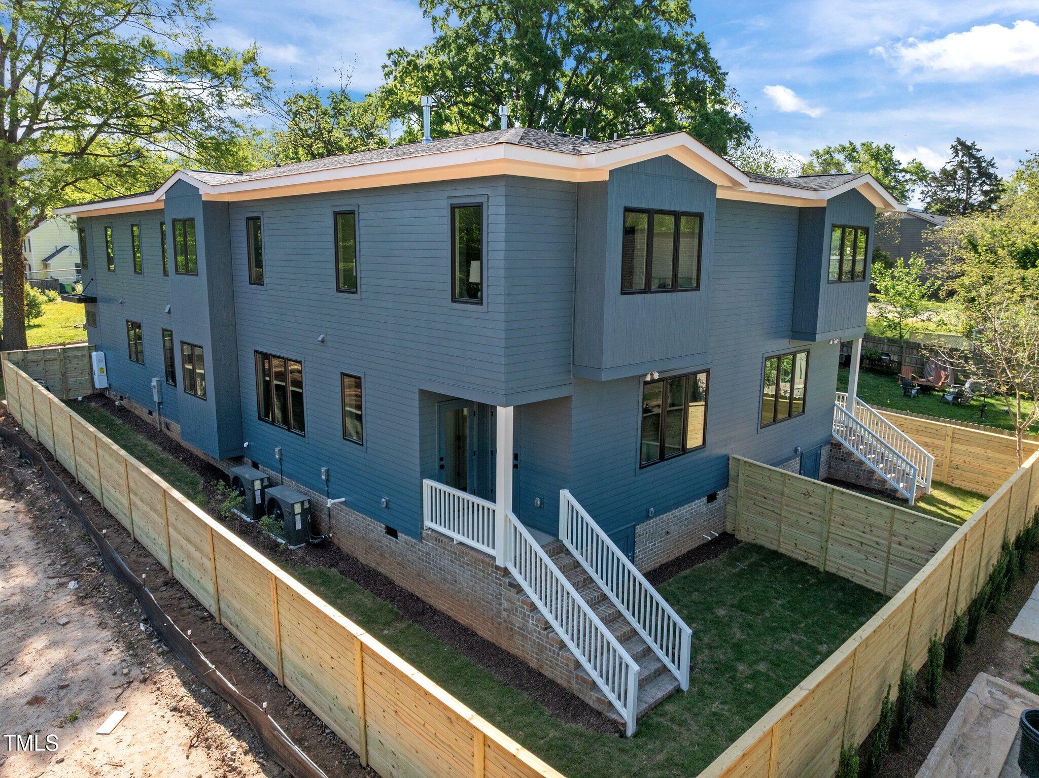 805 Tower Street, Unit 102 Raleigh, NC 27607 - Photo 32 of 36 a view of a house with pool and chairs