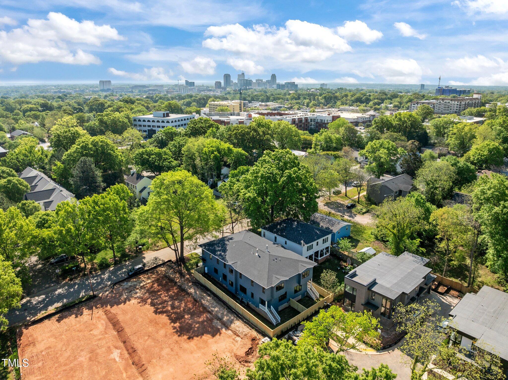 805 Tower Street, Unit 102 Raleigh, NC 27607 - Photo 35 of 36 an aerial view of a house with a yard