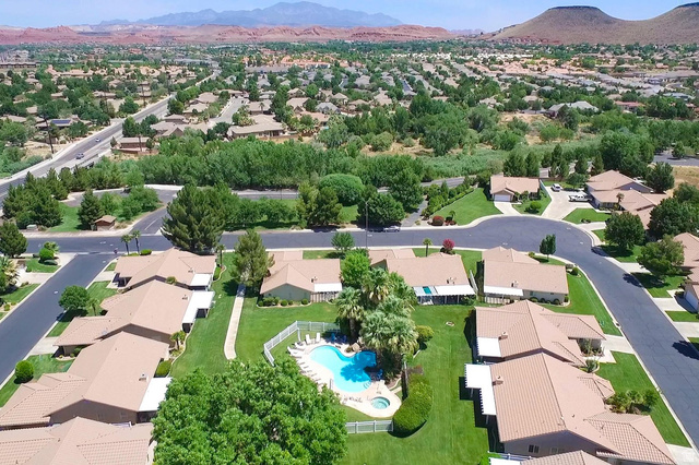 1825 West Mathis Park Place, Unit 40 St. George, UT 84770 - Photo 27 of 28 Aerial view of residential area featuring a mountain backdrop and a pool