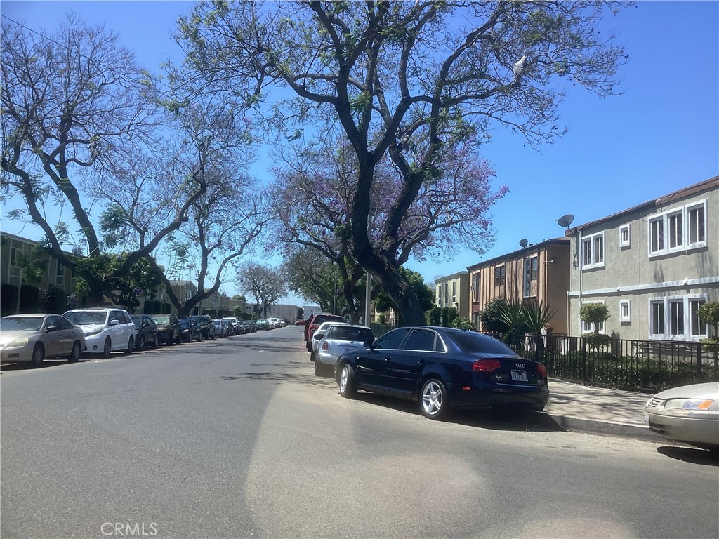a view of street with parked cars