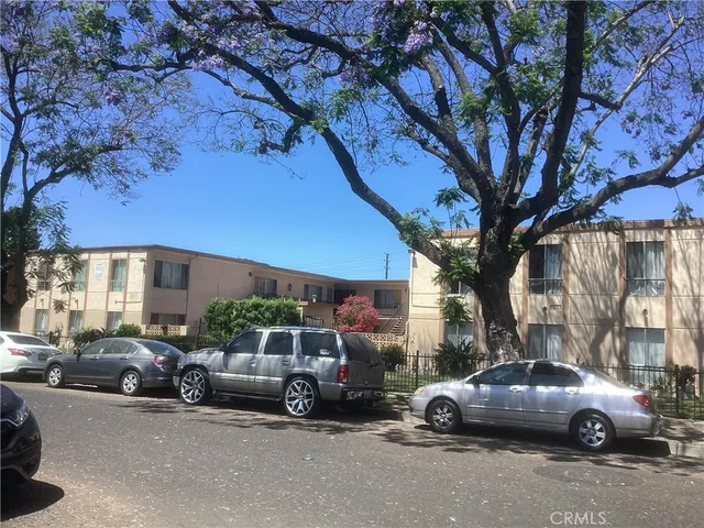 a view of a cars parked in front of a building