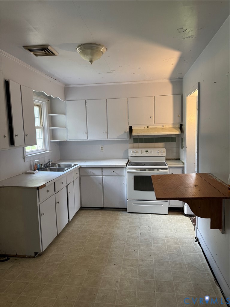 950 Christ Church Road Weems, VA 22576 - Photo 3 of 7 Kitchen featuring stove, open shelves, white cabin