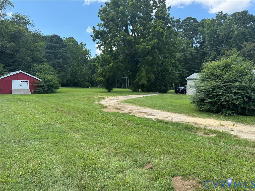 950 Christ Church Road Weems, VA 22576 - Photo 6 of 7 View of grassy yard with shed , circular driveway