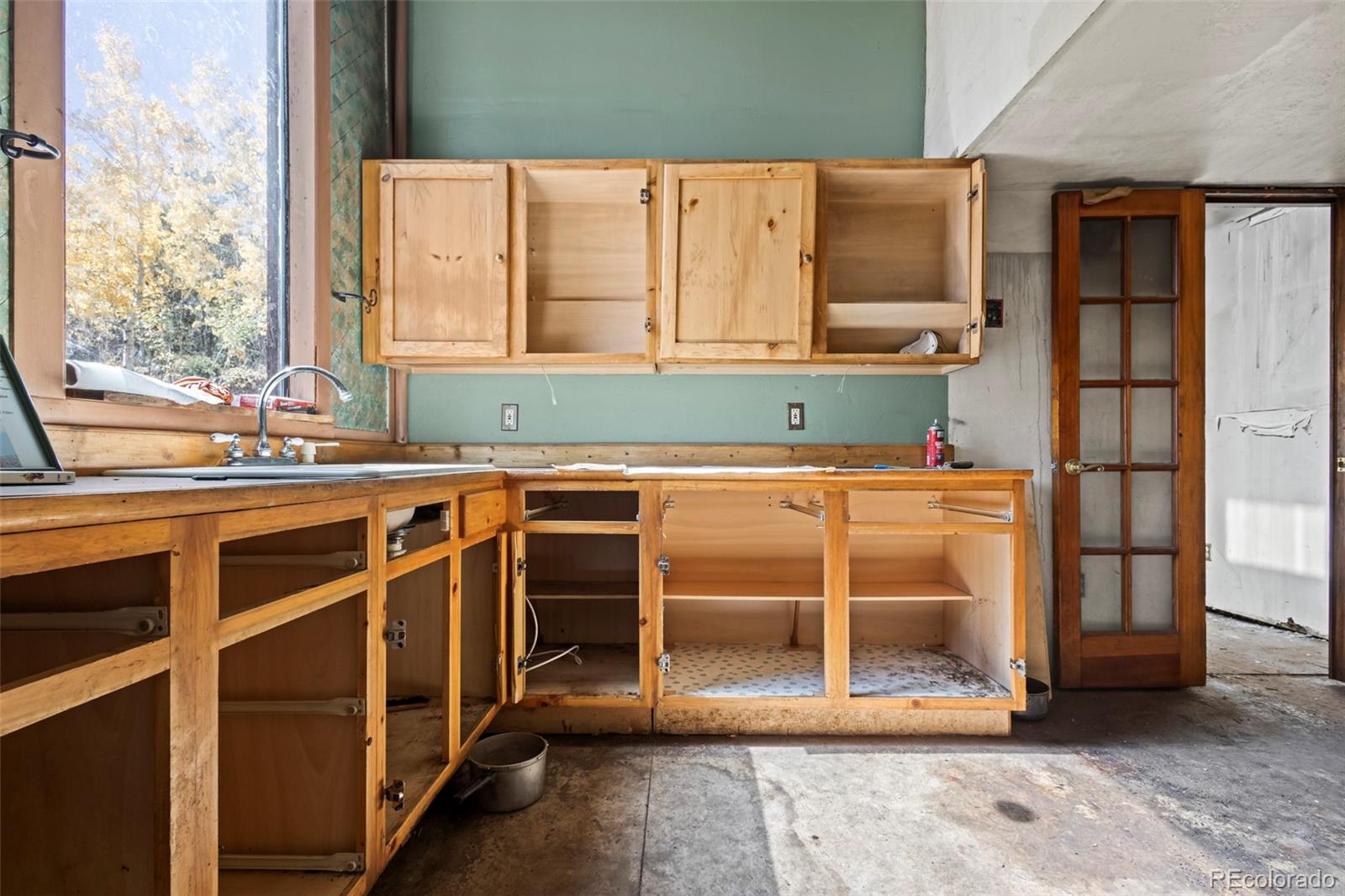 719 Miners Candle Road Idaho Springs, CO 80452 - Photo 12 of 50 a kitchen with stainless steel appliances a stove and a refrigerator