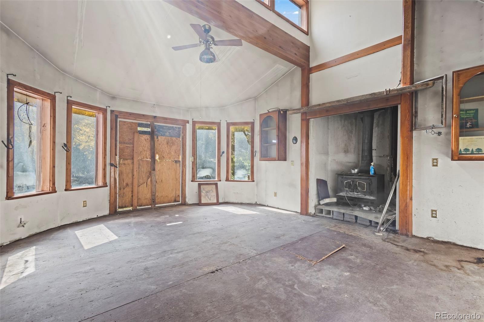 719 Miners Candle Road Idaho Springs, CO 80452 - Photo 16 of 50 a view of an empty room with furniture and a window