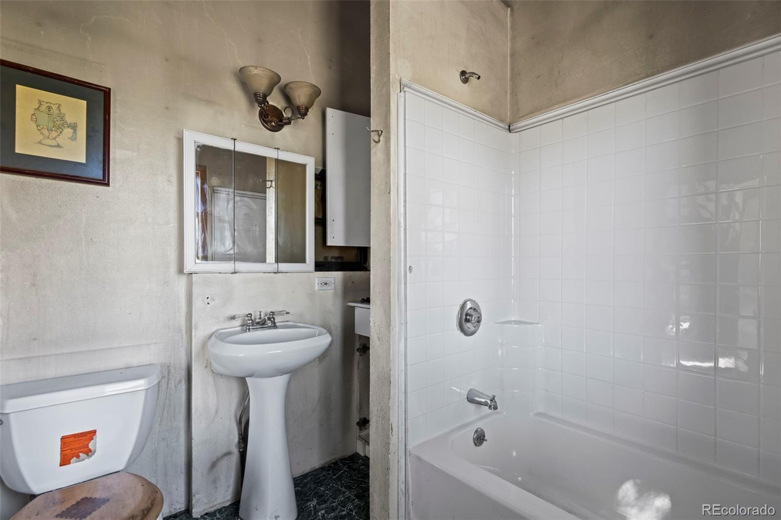 719 Miners Candle Road Idaho Springs, CO 80452 - Photo 19 of 50 a bathroom with a sink toilet and shower
