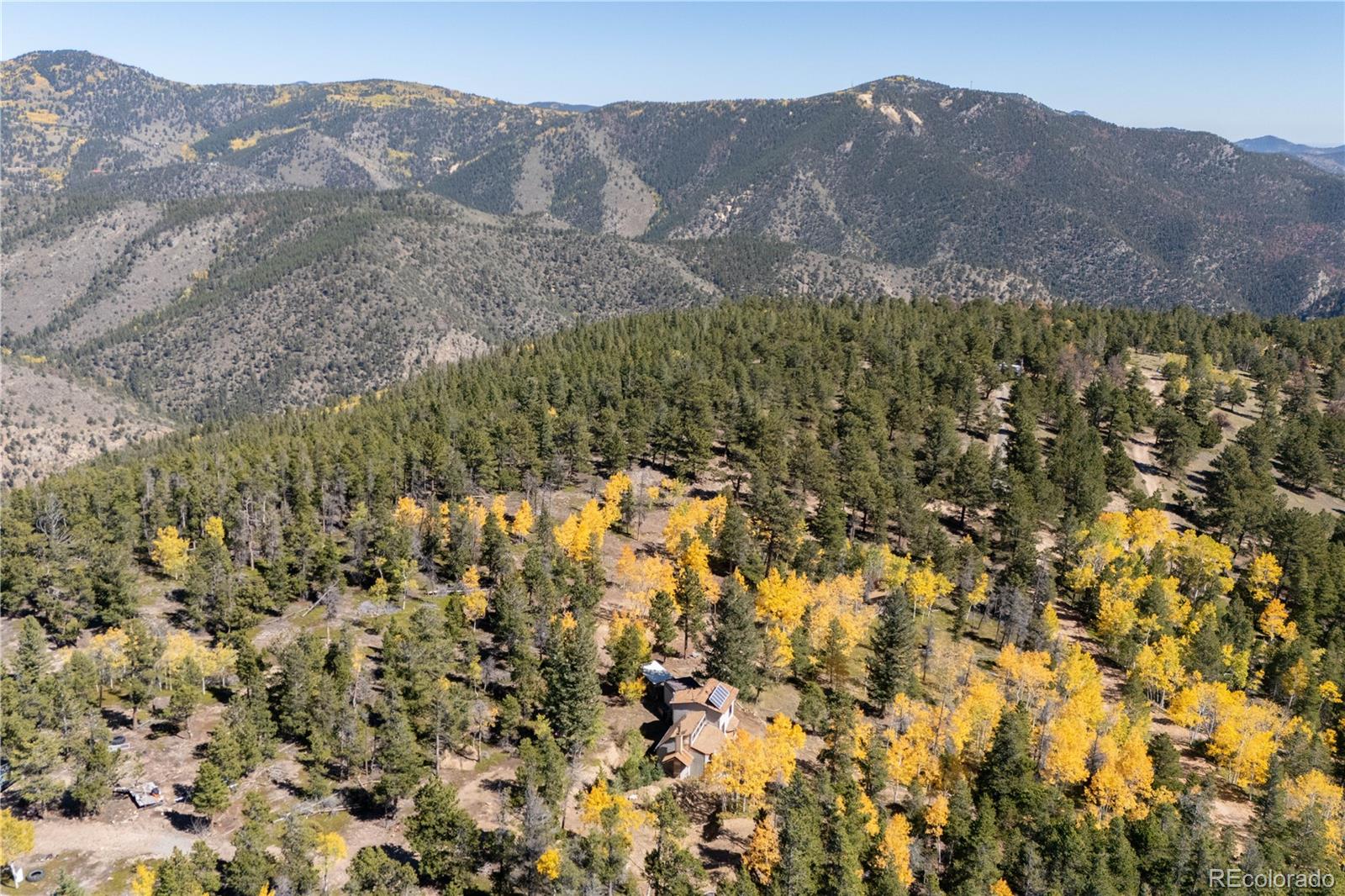 719 Miners Candle Road Idaho Springs, CO 80452 - Photo 31 of 50 a view of a large mountain with mountains in the background