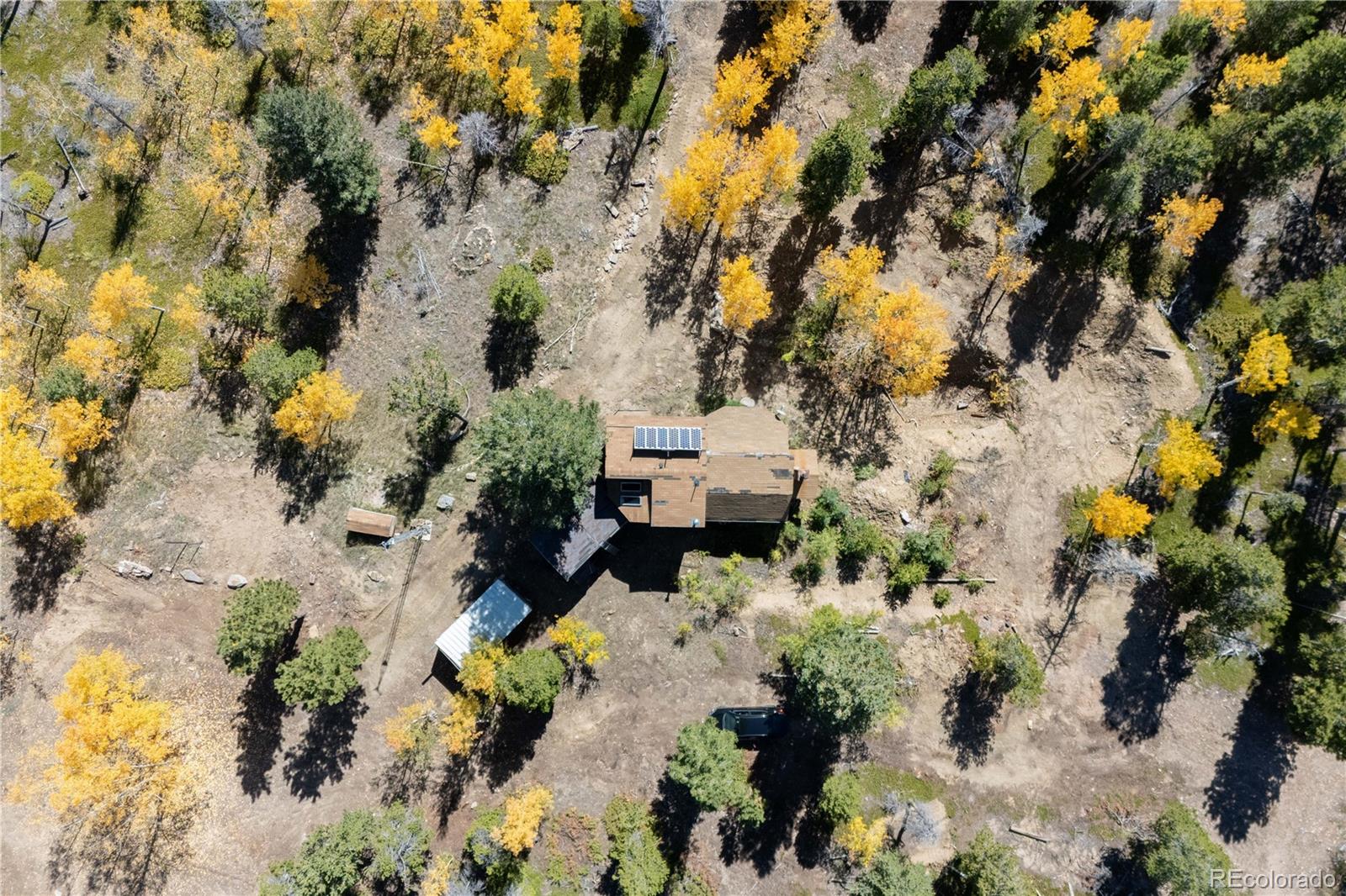719 Miners Candle Road Idaho Springs, CO 80452 - Photo 5 of 50 an aerial view of residential house with yard and swimming pool