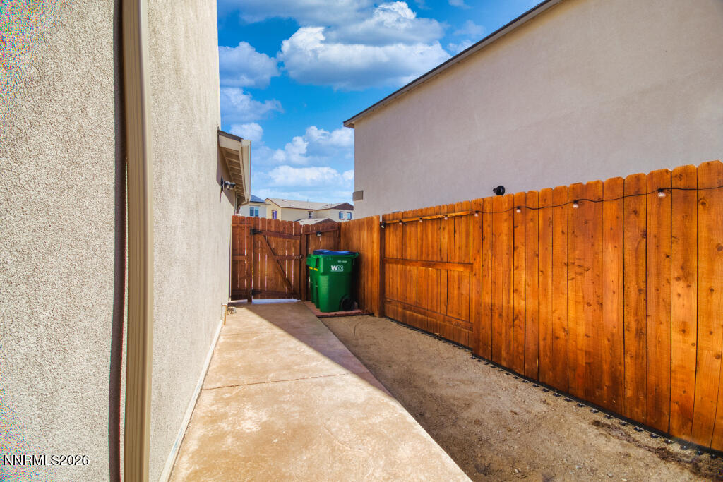 8957 Buffalo Grove Drive Reno, NV 89506 - Photo 47 of 59 a view of a pathway gate with wooden fence