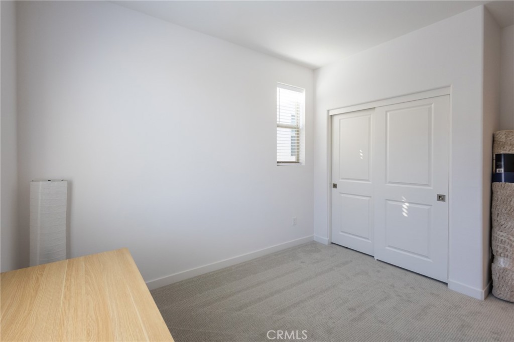 2640 Sprout Lane, Unit 104 Corona, CA 92883 - Photo 11 of 20 a view of a room that has a window in it