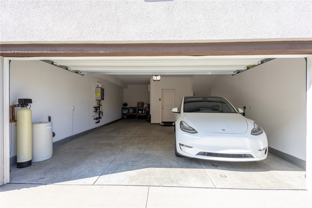 2640 Sprout Lane, Unit 104 Corona, CA 92883 - Photo 16 of 20 a car parked in garage