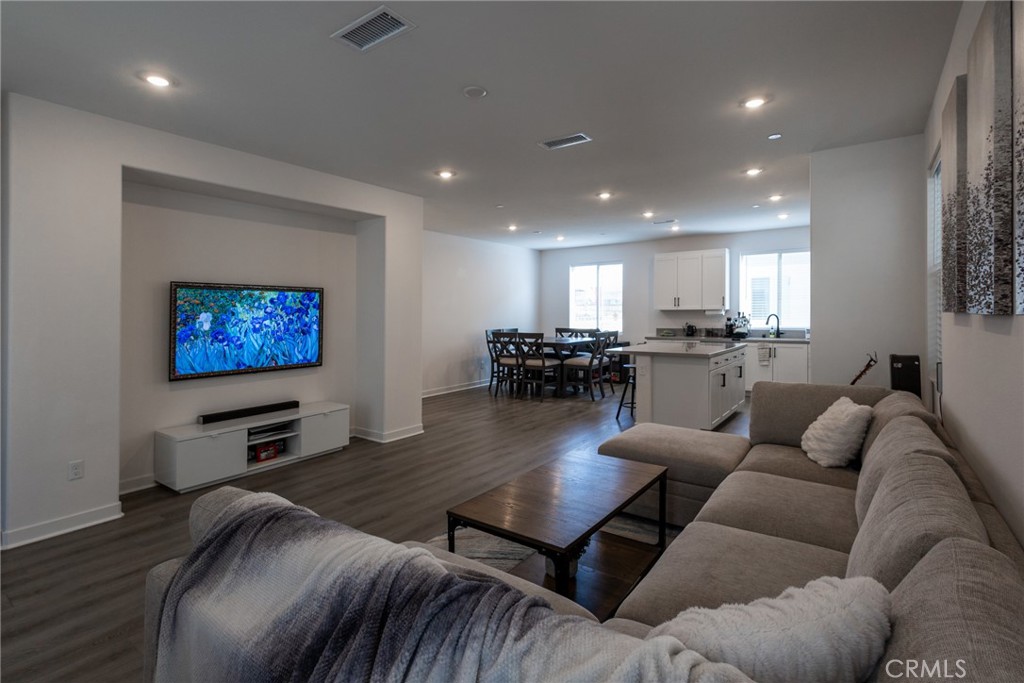 2640 Sprout Lane, Unit 104 Corona, CA 92883 - Photo 2 of 20 a living room with furniture and a flat screen tv