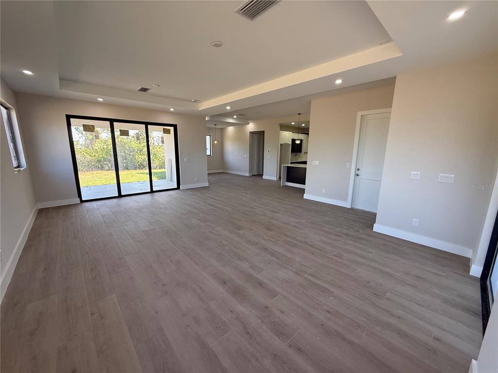 47 Brig Circle East Placida, FL 33946 - Photo 17 of 24 a view of an empty room with wooden floor and a window
