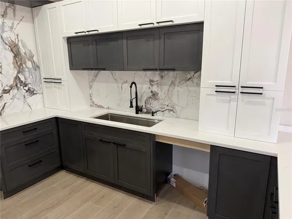 a kitchen with a sink and a cabinets