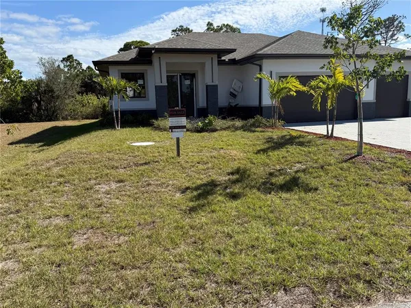 a view of a house with a yard