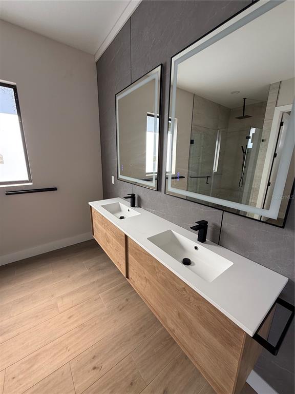 47 Brig Circle East Placida, FL 33946 - Photo 9 of 24 a bathroom with a double vanity sink and mirror