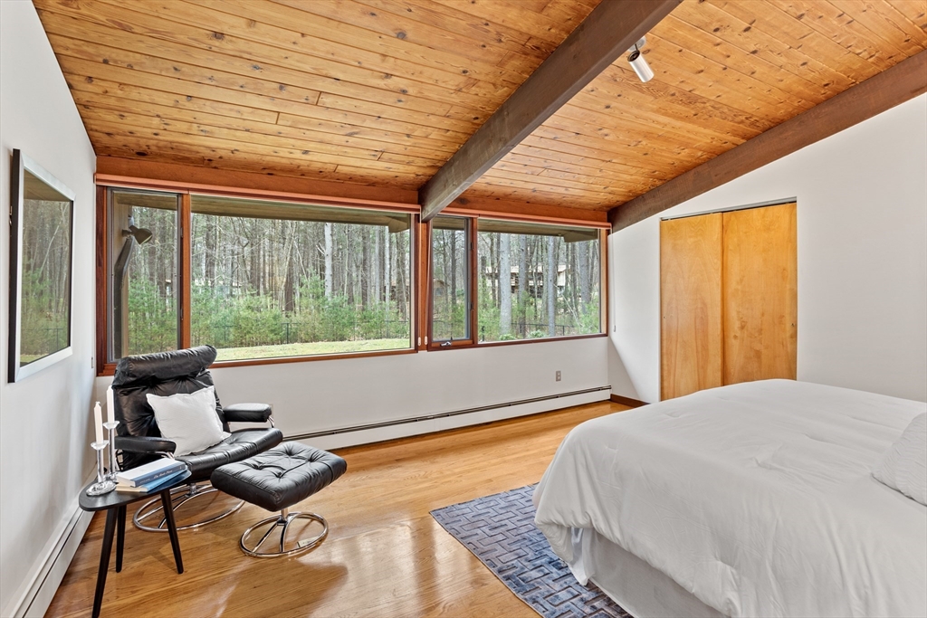 69 Long Ridge Road Carlisle, MA 01741 - Photo 19 of 42 a bedroom with furniture and a large window