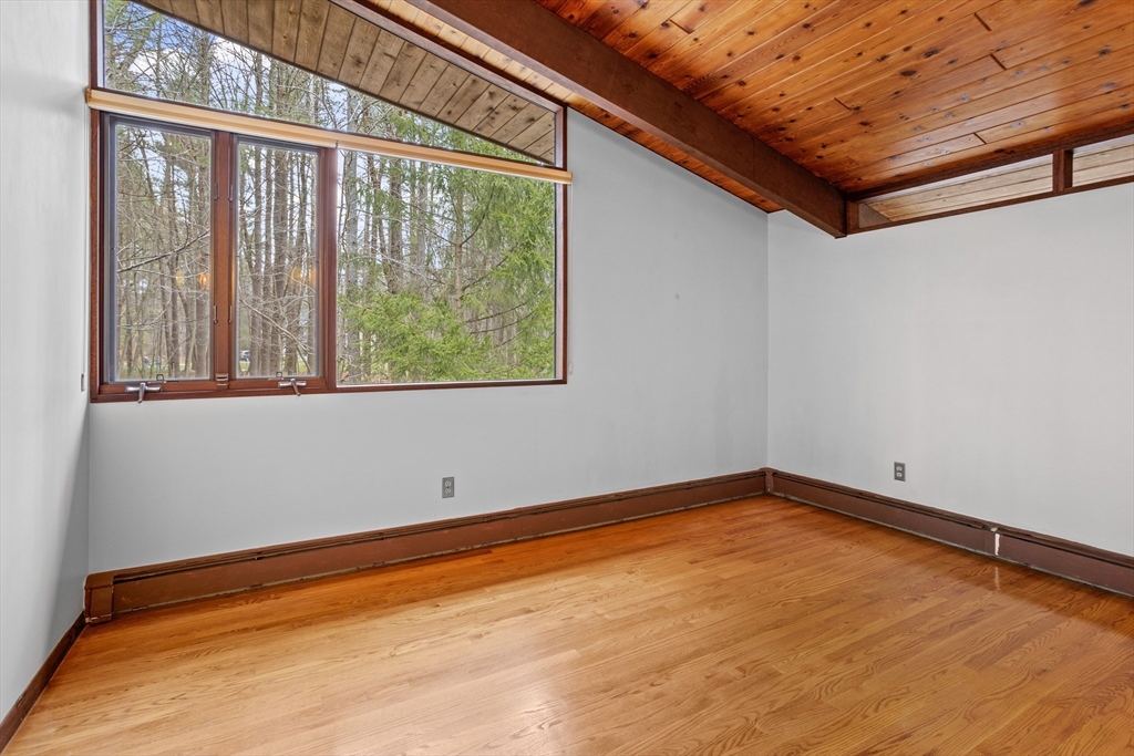 69 Long Ridge Road Carlisle, MA 01741 - Photo 20 of 42 a view of a room with wooden floor and a window
