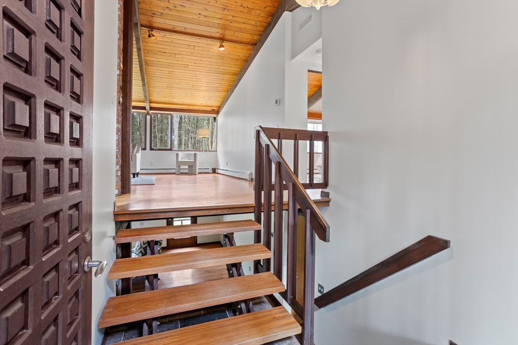 69 Long Ridge Road Carlisle, MA 01741 - Photo 2 of 42 a view of staircase with white walls and a window