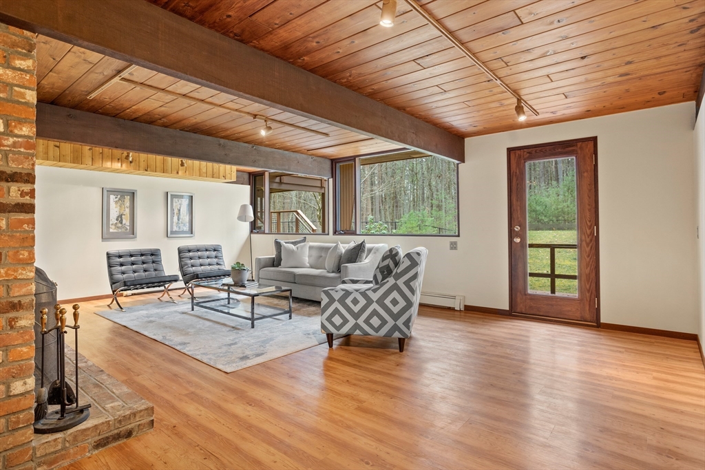69 Long Ridge Road Carlisle, MA 01741 - Photo 24 of 42 a living room with furniture and wooden floor