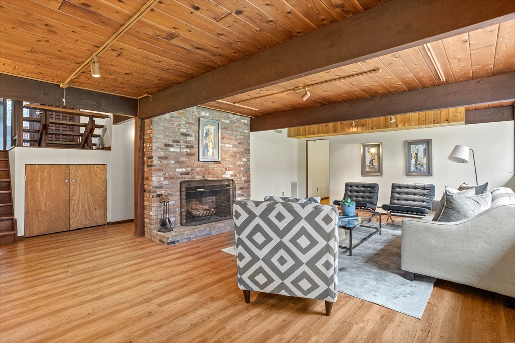 69 Long Ridge Road Carlisle, MA 01741 - Photo 25 of 42 a living room with furniture and fireplace