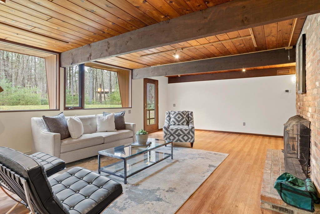 69 Long Ridge Road Carlisle, MA 01741 - Photo 26 of 42 a living room with furniture and a large window