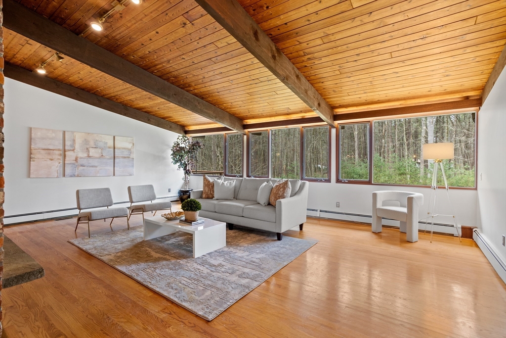 69 Long Ridge Road Carlisle, MA 01741 - Photo 3 of 42 a living room with patio furniture and a large window
