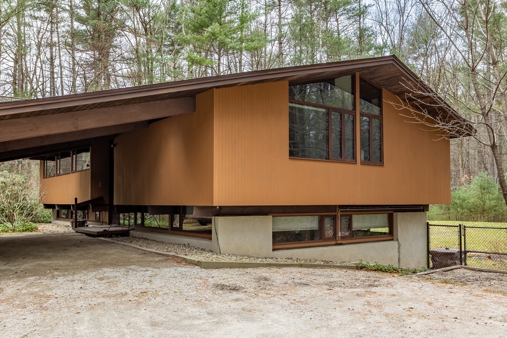 69 Long Ridge Road Carlisle, MA 01741 - Photo 36 of 42 a front view of a house with a yard
